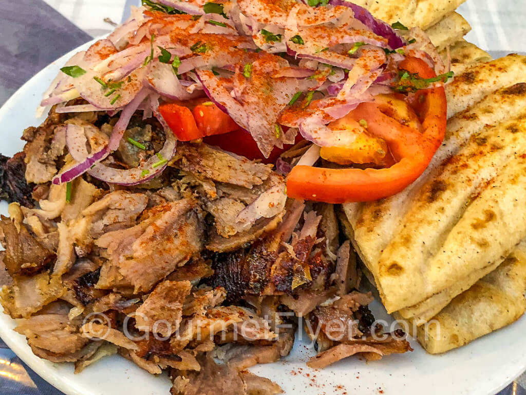 A large plate of souvlaki with grilled chicken.