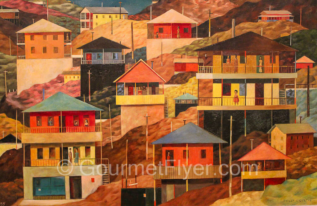 Southwestern painting of colorful houses.