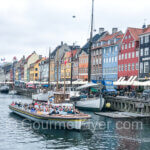 The boat of the canal tour leaving Nyhavn.