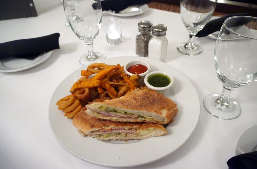 Traditional Cuban sandwich served on a plate.