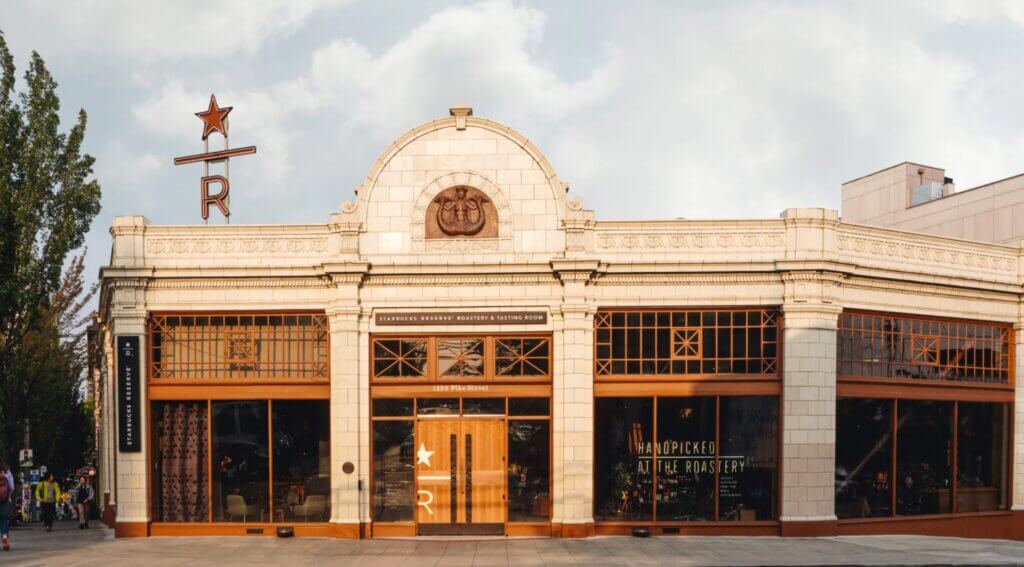 Front of the building of Starbucks Roastery and its front door.