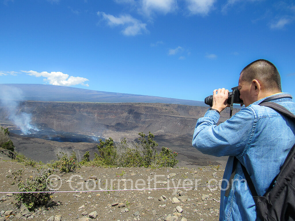 The Gourmet Flyer taking pictures at the volcano viewpoint.