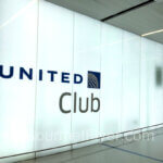 Floor to Ceiling glass panels with the imprint of United Club on them.