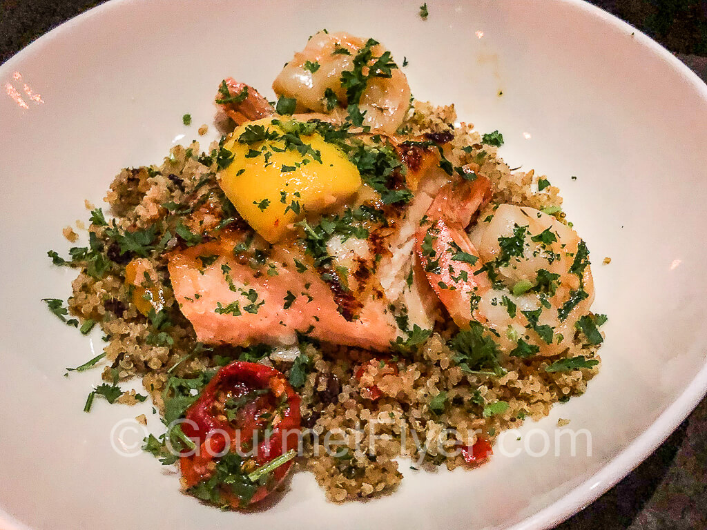 A plate of tiger prawns and salmon.