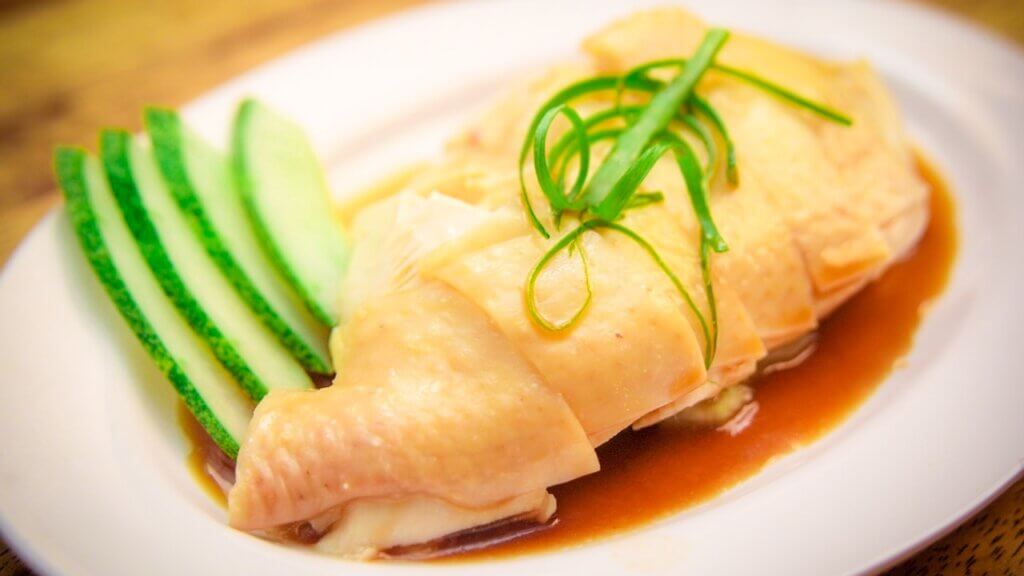 A Hainanese chicken thigh cut up into pieces.