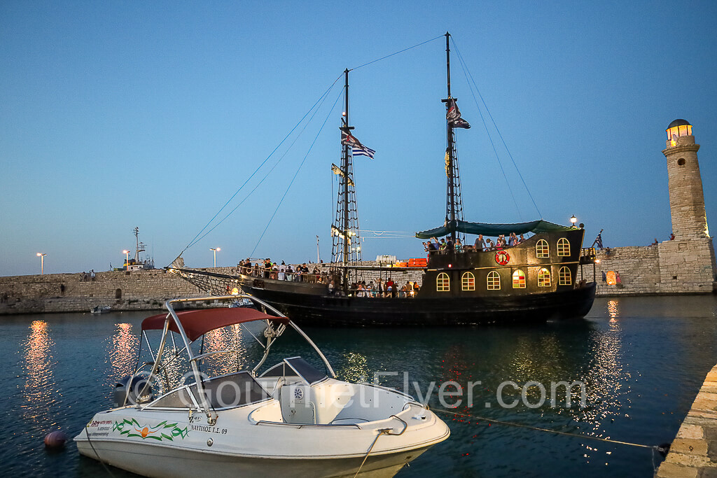 The pirate boat Captain Hook lingering inside the Venetian Harbor at dusk.
