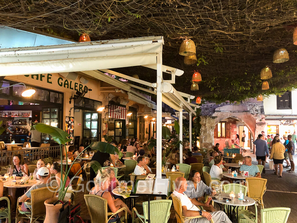 Lively outside seating area of Cafe Galero at night.