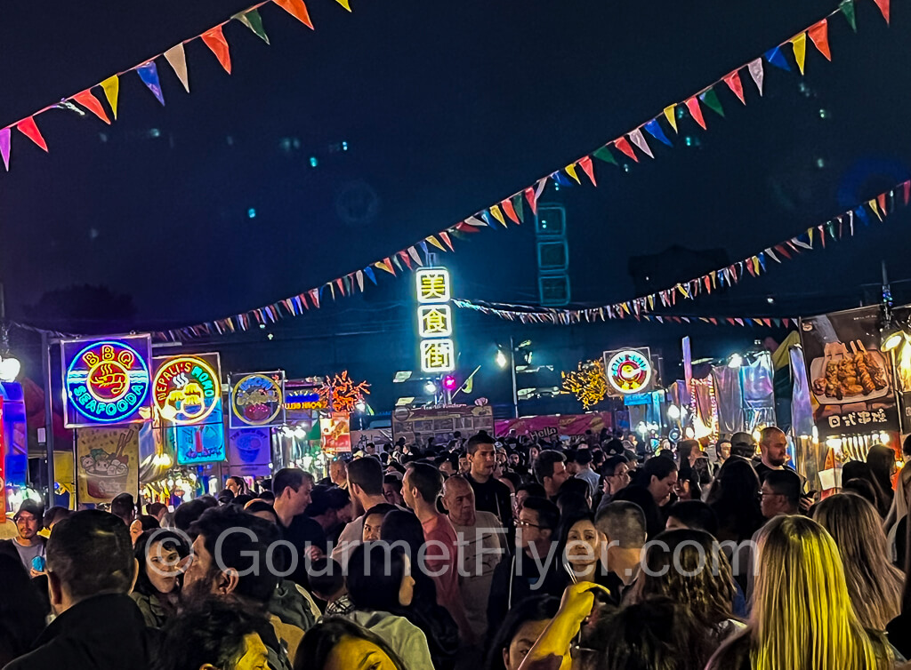 The lively and packed "food street" in the night market.