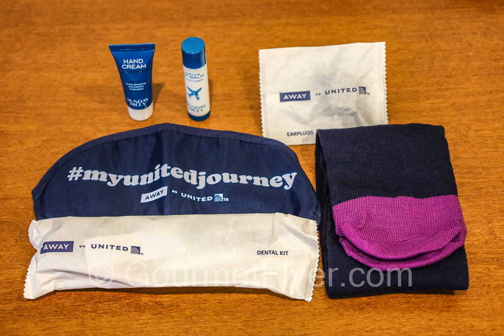 The contents of United's Premium Plus include lotions, disposable socks, toothbrush and ear plugs.