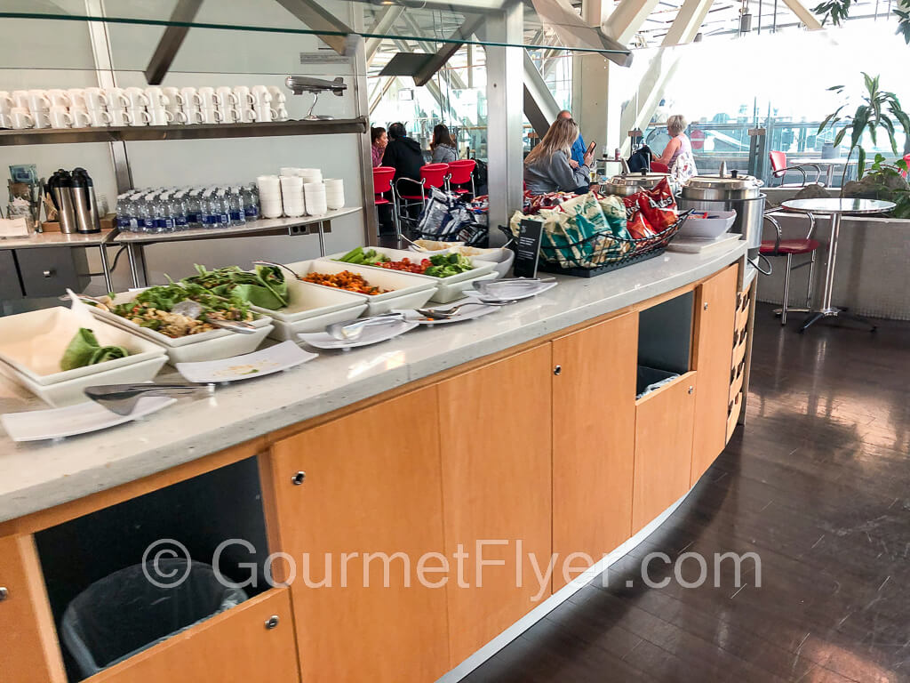 The large buffet counter with dining tables in the background.
