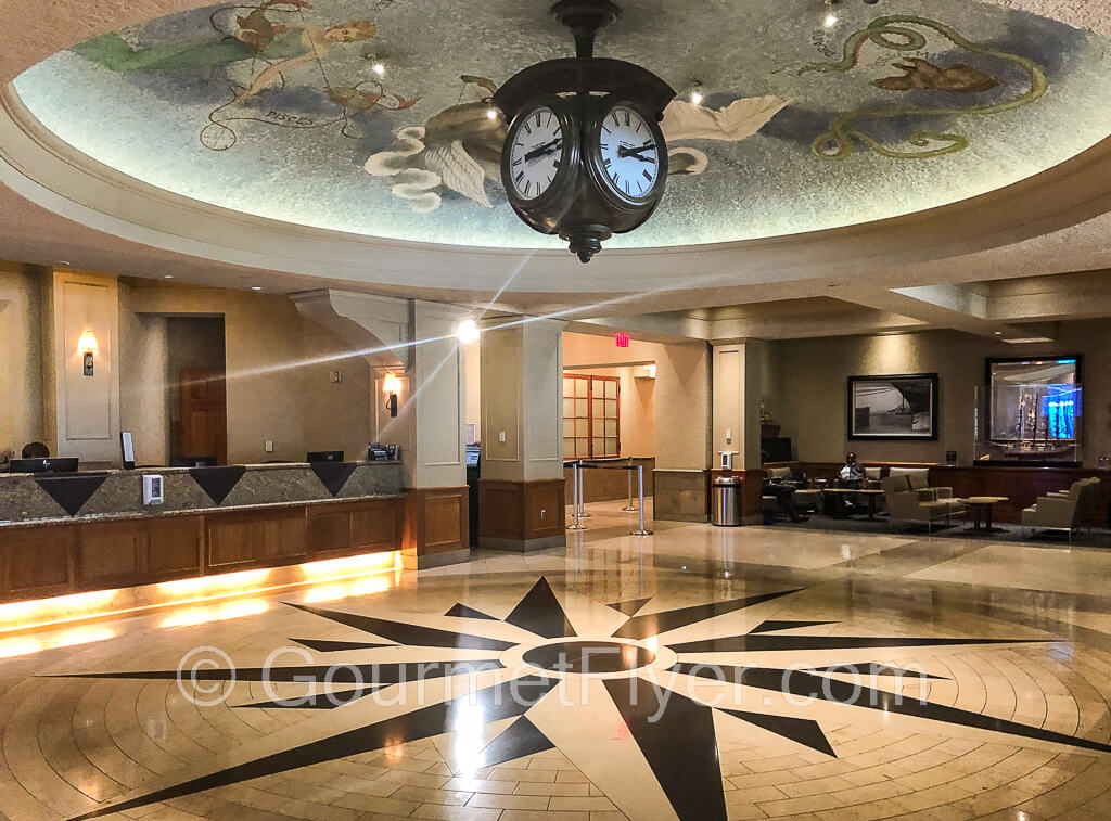 Review of United Club San Francisco SFO F Gates Rotunda features a grand lobby with ceiling fresco.