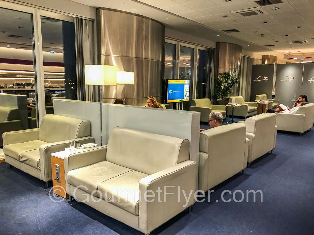 Review of Aegean Business Lounge Athens ATH displays comfy sofas in the main area.