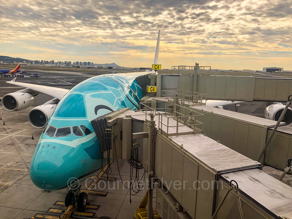 Three jet bridges are connected to the Airbus A380 double decker.