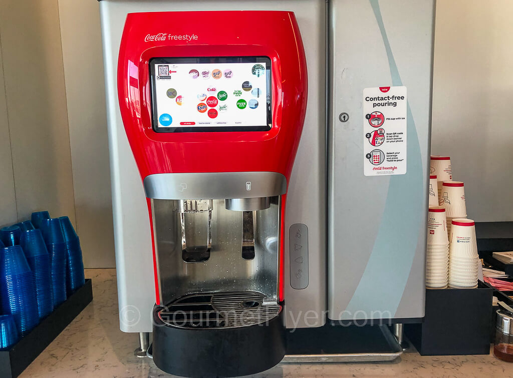Fountain machine with a large selection of drinks on screen.