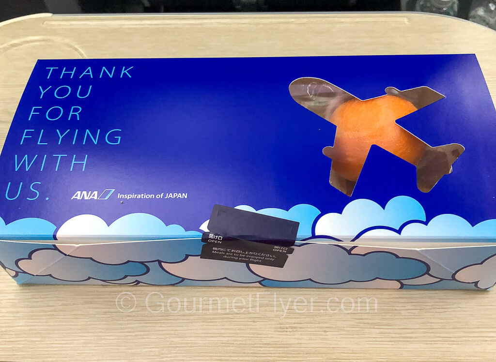 A snack box with a plane logo and a thank you message.