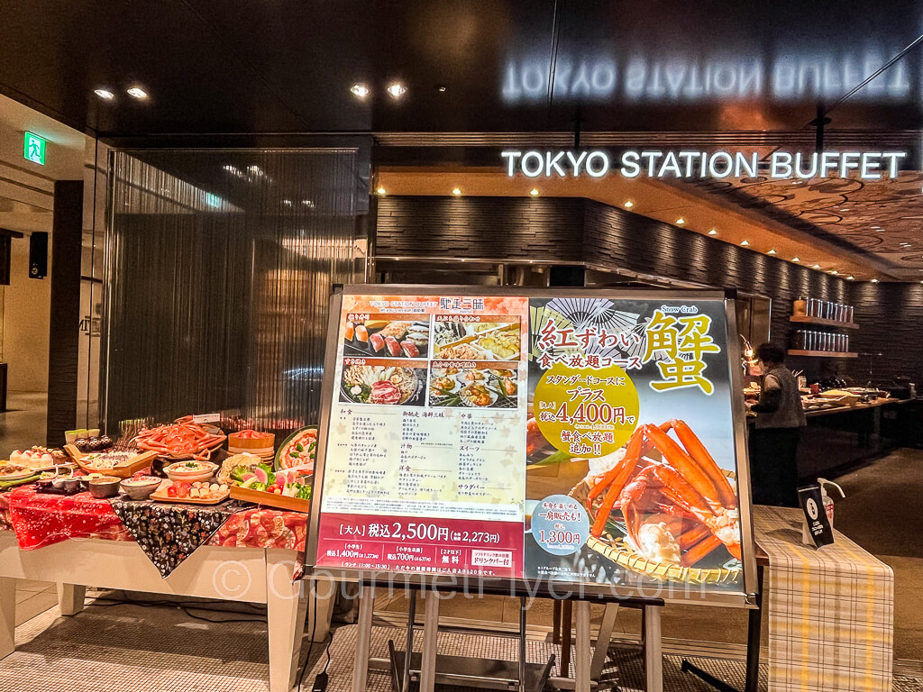 Front entrance to the restaurant with a big menu sign.