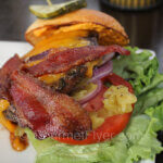 Best places to eat in Phoenix and Scottsdale features a burger loaded with bacon and green chili.