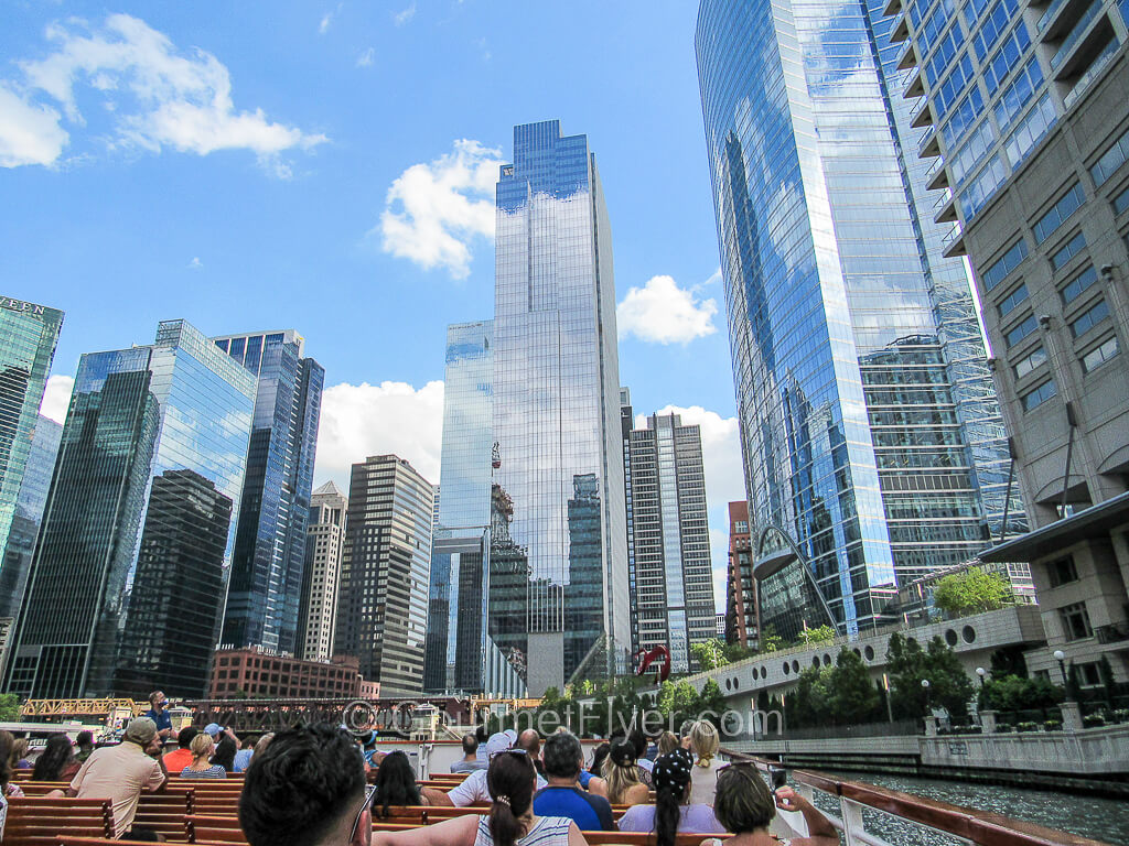 Passengers on a Chicago River cruise boat are enjoying great views of the city's skyline.