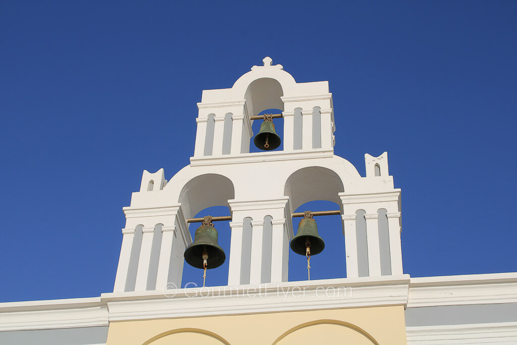 The 3 bells of Fira on the roof of a church.