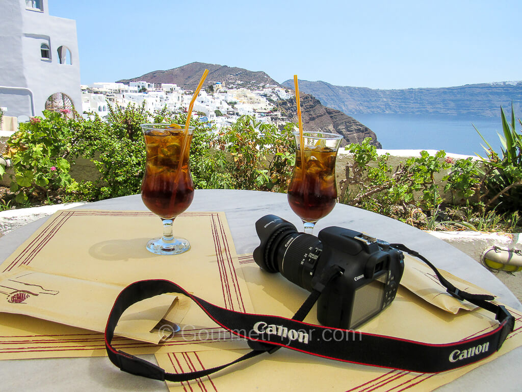 Two glasses of iced tea on our table at a restaurant, overlooking a gorgeous view.