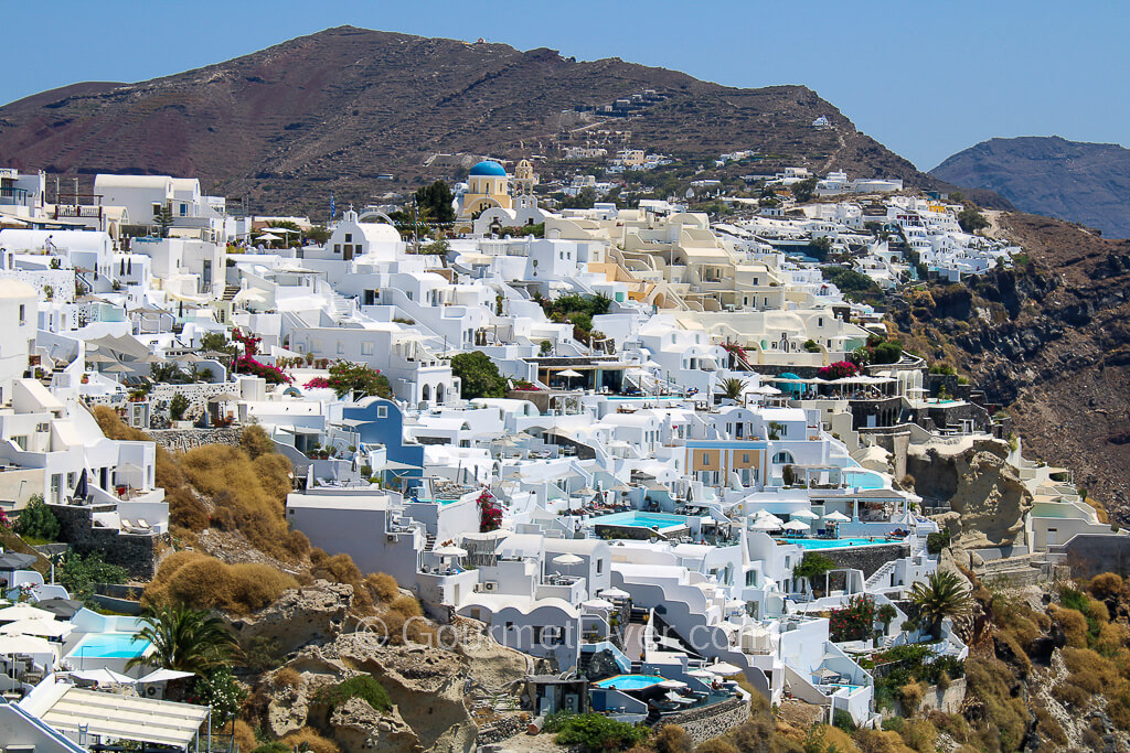 Amazing view of whitewashed buildings on the hill of Oia.
