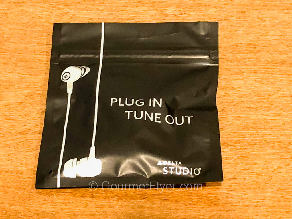 A packet with an illustration of a pair of earbuds.