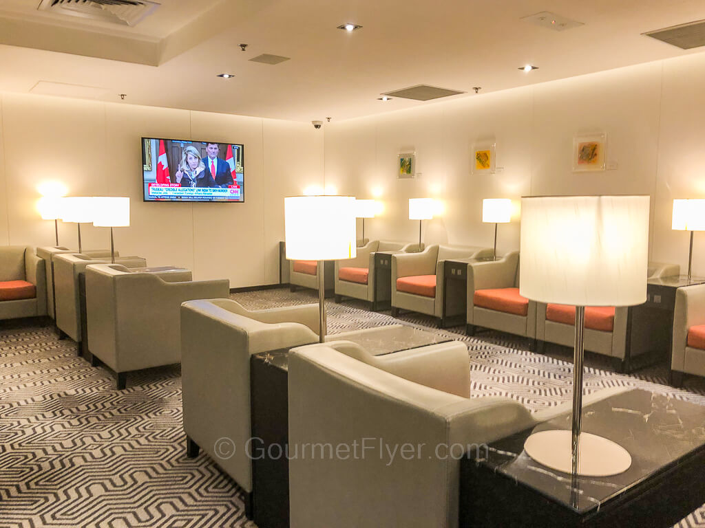 This is another area within the club with single rows of comfy sofas with coffee tables and lamps.