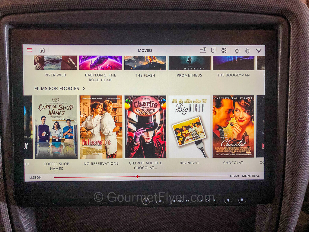 A seat-back entertainment screen is shown here with a selection of movies under the heading "films for foodies".