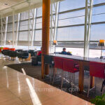 Review of Air Canada's Maple Leaf Lounge in Montreal features a spacious and comfortable seating area by the window.