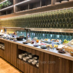 The TAP Premium Lounge in the Non-Schengen area features a long buffet counter with many varieties of hot and cold food.