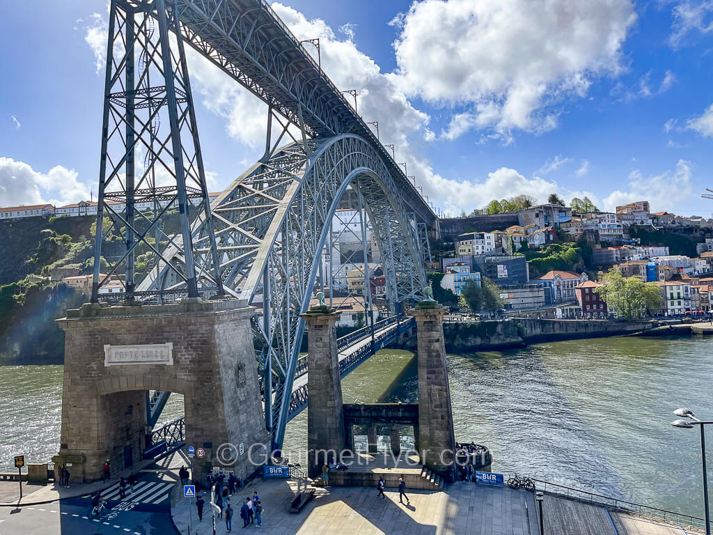 The double-deck Dom Luis I Bridge as seen from the lower deck entrance in Porto, with Gaia across the river.