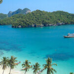 Modern Travel Traditions in Thailand features a boat sailing on turquoise waters under blue skies.