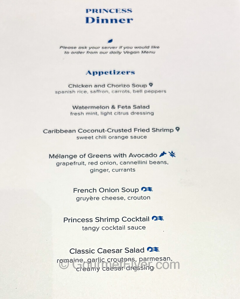 A cruise ship dinner menu displays a dozen options of appetizers, soups, and salads.